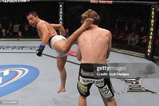 John Makdessi lands a kick against Pat Audinwood during their Leightweight bout during UFC 124 at the Centre Bell on December 11, 2010 in Montreal,...