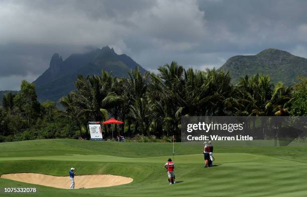 Jaco Van Zyl of South Africa plays out of the third greenside bunker during the third round of the AfrAsia Bank Mauritius Open at Four Seasons Golf...