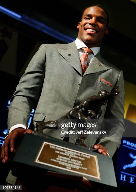 Cam Newton, quarterback of the Auburn University Tigers, speaks after being awarded the 2010 Heisman Memorial Trophy Award on December 11, 2010 in...