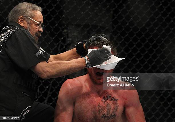Dan Miller receives treatment after his fight against Joe Doerksen during their Middleweight bout during UFC 124 at the Centre Bell on December 11,...