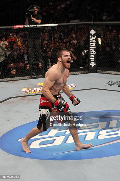 Jim Miller reacts after he won his fight by submission against Charles Oliveira during their Lightweight "Swing" bout during UFC 124 at the Centre...