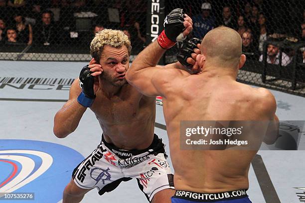 Josh Koscheck lands a punch against Georges St-Pierre during their Welterweight Title bout during UFC 124 at the Centre Bell on December 11, 2010 in...