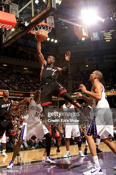 Dwyane Wade of the Miami Heat dunks the ball against the Sacramento Kings at ARCO Arena on December 11, 2010 in Sacramento, California. NOTE TO USER:...