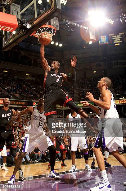 Dwyane Wade of the Miami Heat dunks the ball against the Sacramento Kings at ARCO Arena on December 11, 2010 in Sacramento, California. NOTE TO USER:...