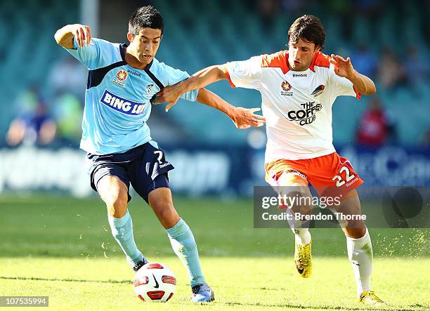 Brendan Gan of Sydney competes with Thomas Broich of the Roar during the round 18 A-League match between Sydney FC and the Brisbane Roar at Sydney...