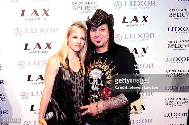 Artist Michael Gader and guest arrive for Criss Angel's birthday and 1000th 'Criss Angel BeLIEve' show at LAX Nightclub on December 11, 2010 in Las...