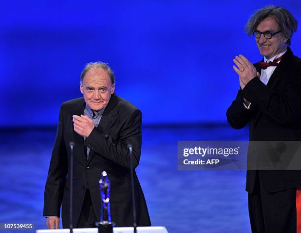 The president of the European Film Academy, German film director Wim Wenders , applauds Swiss actor Bruno Ganz after the latter received the European...