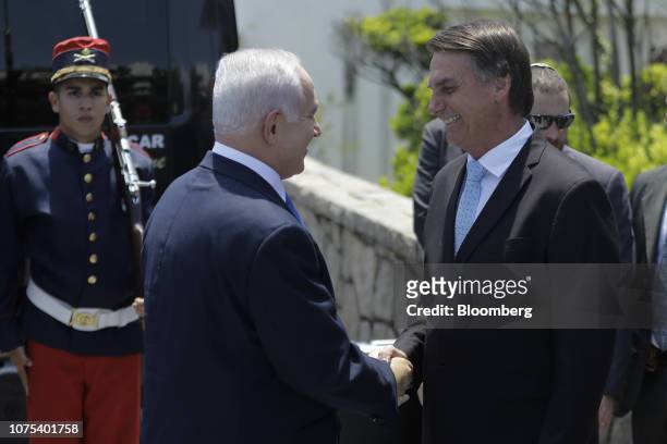 Jair Bolsonaro, Brazil's president-elect, right, shakes hands with Benjamin Netanyahu, Israel's prime minister, at Fort Copacabana in Rio de Janeiro,...