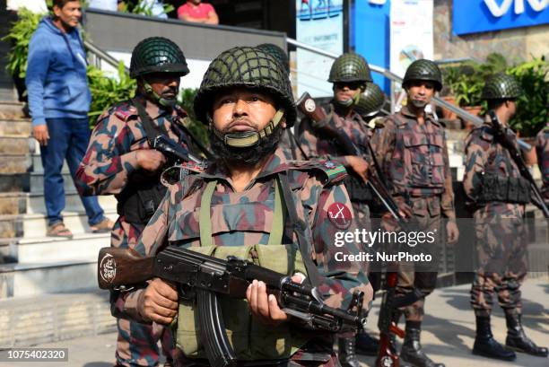 Members of Border Guard Bangladesh stand guard in a street for the upcoming election in Dhaka, Bangladesh on December 28, 2018. Election security...