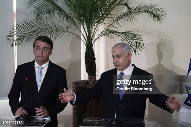 Benjamin Netanyahu, Israel's prime minister, right, speaks as Jair Bolsonaro, Brazil's president-elect, listens during a press conference at Fort...