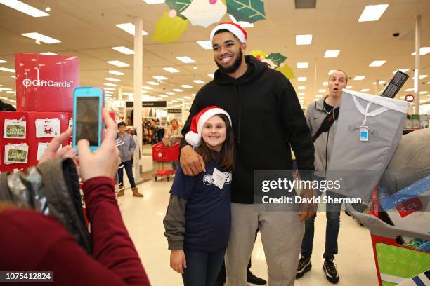 Karl-Anthony Towns of the Minnesota Timberwolves goes holiday shopping with children and their families from United Heroes League during the...