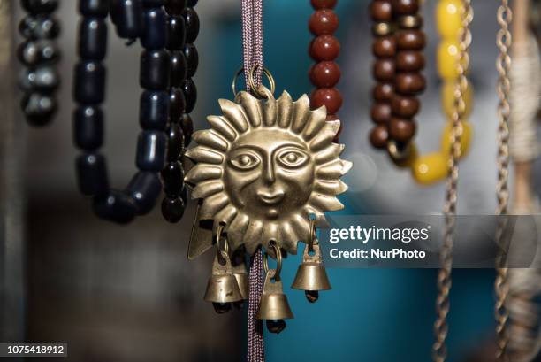 Kompoloi - a kind of rosary and a sun with bells is seen in a Vintage Shop In Chalkida, Greece, on 27 December 2018.