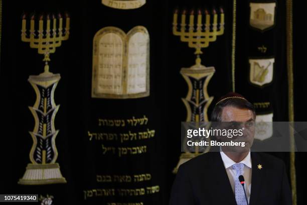 Jair Bolsonaro, Brazil's president-elect, speaks during an event at a synagogue with Benjamin Netanyahu, Israel's prime minister, not pictured, in...