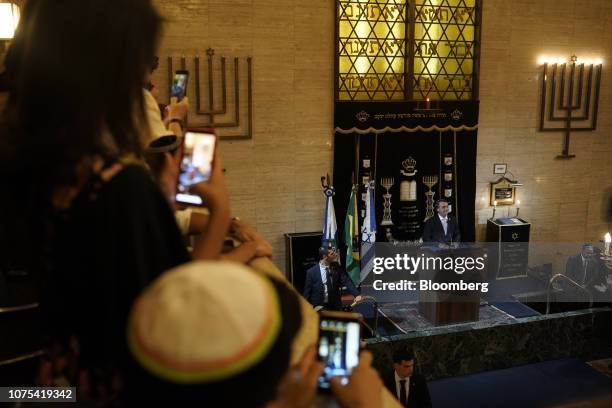 Jair Bolsonaro, Brazil's president-elect, speaks during an event at a synagogue with Benjamin Netanyahu, Israel's prime minister, not pictured, in...