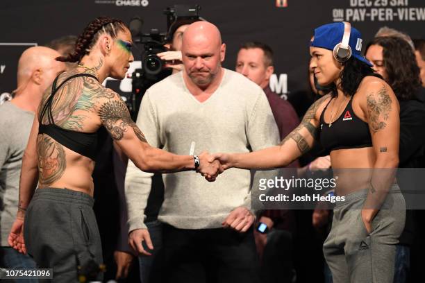 Opponents Cris Cyborg of Brazil and Amanda Nunes of Brazil shake hands during the UFC 232 weigh-in inside The Forum on December 28, 2018 in...