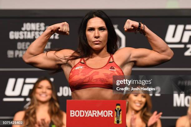 Cat Zingano poses on the scale during the UFC 232 weigh-in inside The Forum on December 28, 2018 in Inglewood, California.