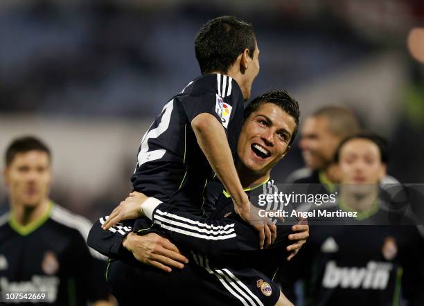 Angel di Maria of Real Madrid celebrates with his team mate Cristiano Ronaldo after scoring Real's third goal during the La Liga match between Real...