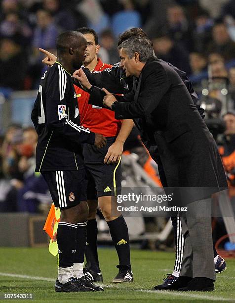 Head coach Jose Mourinho of Real Madrid gives instructions to Lass Diarra during the La Liga match between Real Zaragoza and Real Madrid at La...