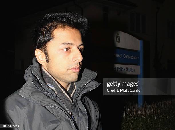 Shrien Dewani leaves Southmead Police station escorted by police officers after he reported there as part of his bail conditions on December 12, 2010...