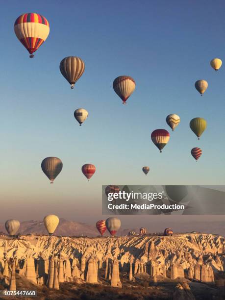 flying over cappadocia in a hot air balloon - hot air balloon festival stock pictures, royalty-free photos & images