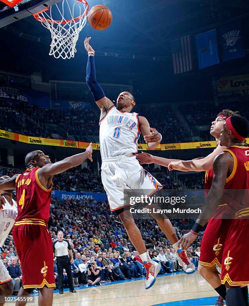 Russell Westbrook of the Oklahoma City Thunder shoots against Antawn Jamison of the Cleveland Cavaliers on December 12, 2010 at the Ford Center in...