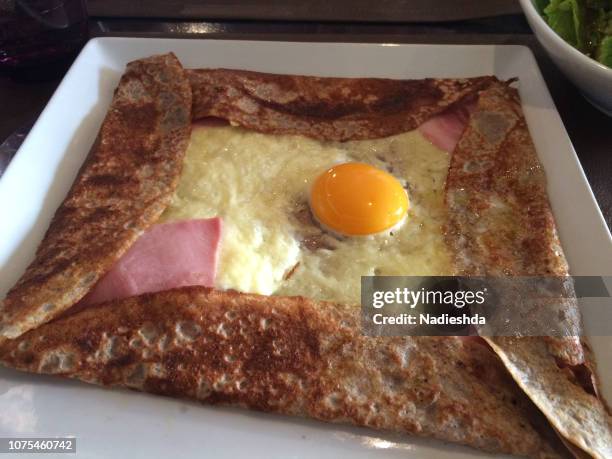 french crepe with ham, cheese and egg. - crepe textile stock-fotos und bilder