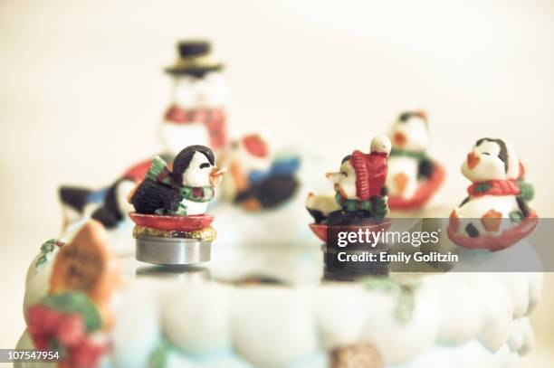 skating penguin figurines - music box stock pictures, royalty-free photos & images