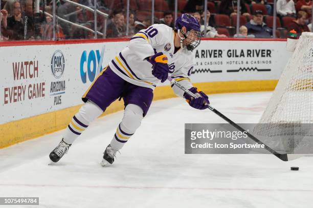 Minnesota State Mavericks forward Shane McMahan controls the puck during the college hockey game between the Minnesota-Duluth Bulldogs and the...