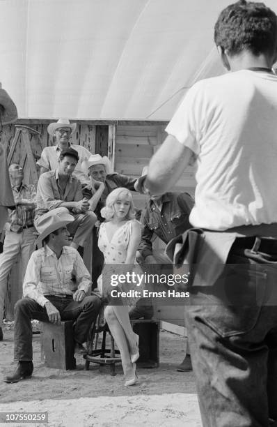 The cast and crew of John Huston's 'The Misfits' line up for a publicity shoot, USA, 1960. The group includes writer Arthur Miller, director John...