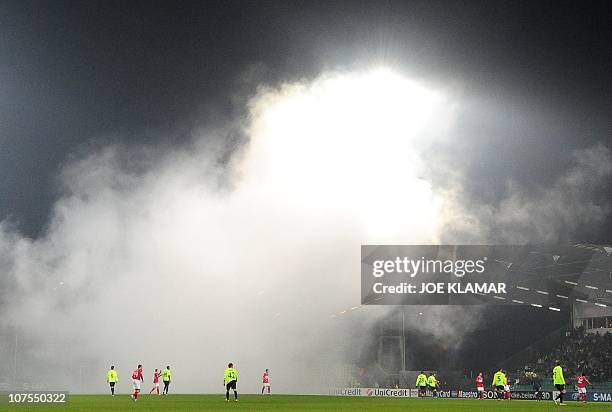 Players of MSK ZIlina and of Spartak Moscow take a break due to fan problems during their group F UEFA Champion's league match between MSK ZIlina and...