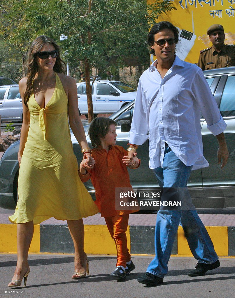 Indian businessman Arun Nayar (R) walks