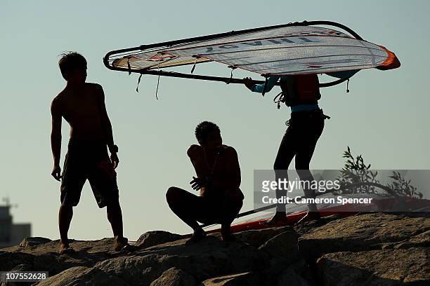 Competitors pack up their windsurfers following their event at Al-Musannah Sports City during day six of the 2nd Asian Beach Games Muscat 2010 on...