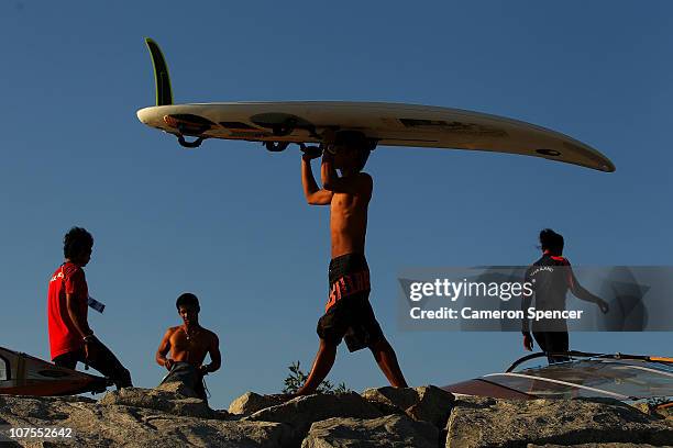 Competitors pack up their windsurfers following their event at Al-Musannah Sports City during day six of the 2nd Asian Beach Games Muscat 2010 on...