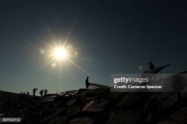 Competitors pack up their windsurfers following their event at Al-Musannah Sports City during day six of the 2nd Asian Beach Games Muscat 2010 on...