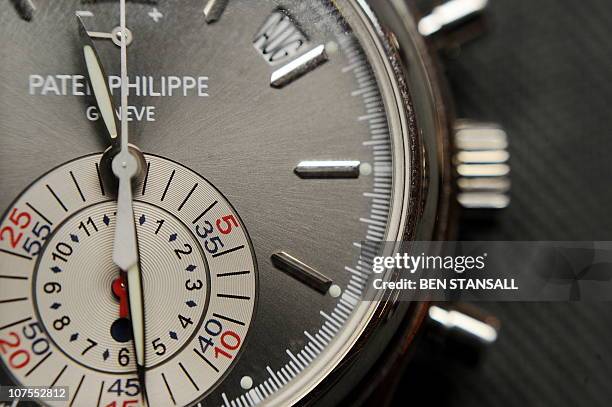Patek Philipe, rare platinum automatic flyback chronograph annual calendar wristwatch, is pictured at Bonhams auctioneers in central London, on...