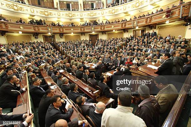 Egypt's new parliament convenes for the first time in Cairo on December 13 as about 20 opposition lawmakers defeated in disputed legislative polls...