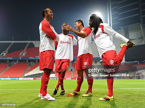 Alecsandro, Andrezinho, Indio and Tinga of SC Internacional warm up during a training session at Mohamed Bin Zayed Stadium on December 13, 2010 in...