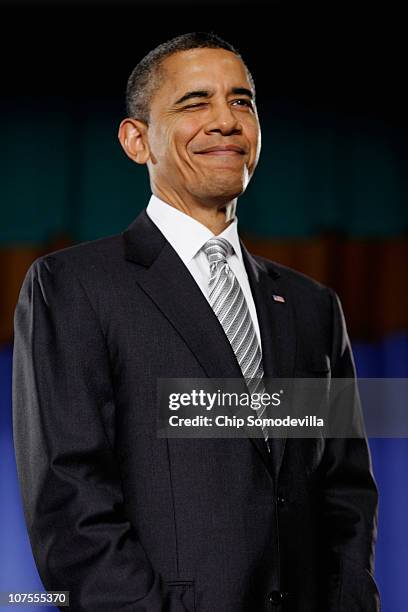 President Barack Obama winks to the audience before signing the Healthy, Hunger-Free Kids Act of 2010 at Harriet Tubman Elementary School December...