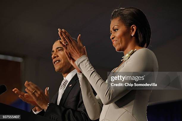 President Barack Obama and first lady Michelle Obama applaud before the president signs the Healthy, Hunger-Free Kids Act of 2010 at Harriet Tubman...