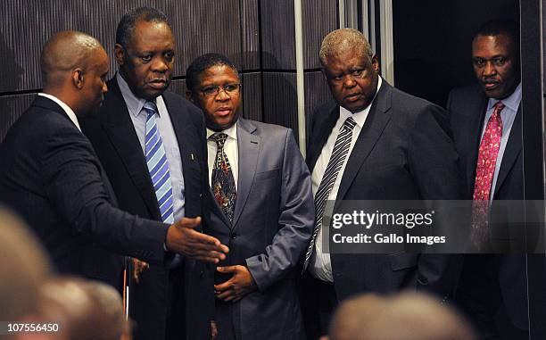 Issa Hayatou, Minister of Sports Fikile Mbalula, Molefe Olifant and Irvin Khoza arrive for the FIFA media briefing at Soccer City on December 13,...