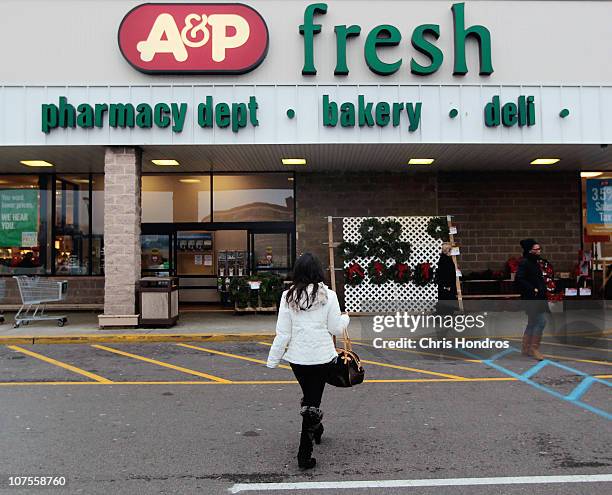 People walk from a A&P supermarket December 13, 2010 in Jersey City, New Jersey. Venerable grocery chain The Great Atlantic & Pacific Tea Company,...