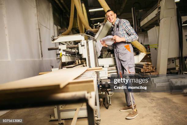 young carpenter with prosthetic leg at work - amputee working stock pictures, royalty-free photos & images
