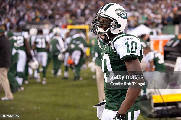 Santonio Holmes of the New York Jets looks on from the bench during the fourth quarter against the Cincinnati Bengals on November 25, 2010 at the New...