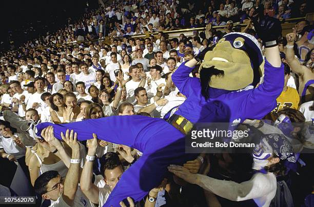 Duke Blue Devils mascot crowd surfing with fans in stands with during game vs North Carolina at Cameron Indoor Stadium.Durham, NC 2/28/1998CREDIT:...