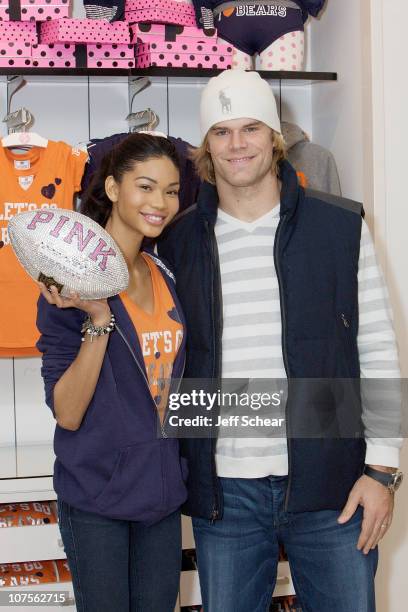 Model Chanel Iman and Chicago Bears football player Greg Olsen celebrate the VS PINK National Football League Collection at VS PINK, Woodfield Mall...