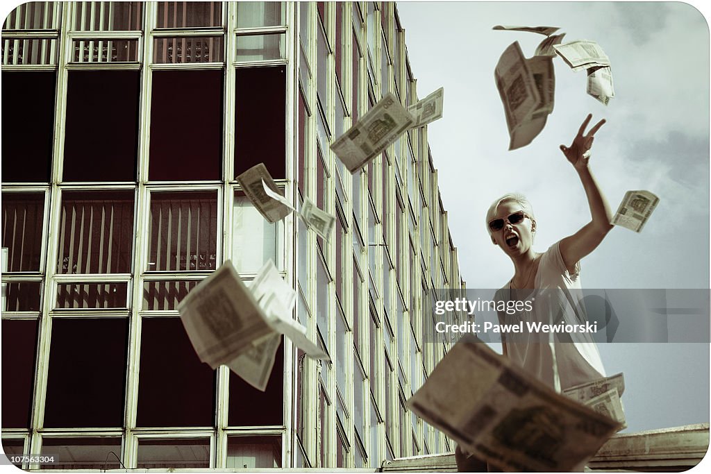 Woman throwing out money