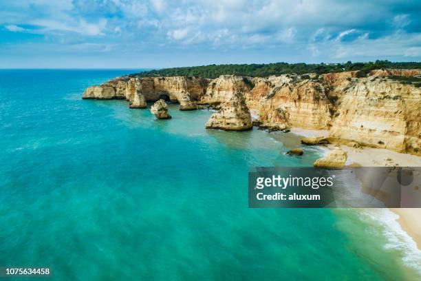 praia da marinha lagoa algarve portugal is considered one of the most beautiful beaches in the world - algarve stock pictures, royalty-free photos & images