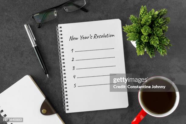 new year resolution on notebook page - spiral notebook table stock pictures, royalty-free photos & images