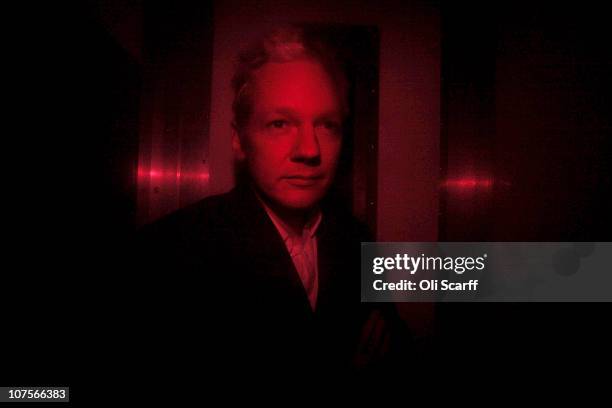 Wikileaks founder Julian Assange arrives at Westminster Magistrates Court inside a prison van with red windows on December 14, 2010 in London,...