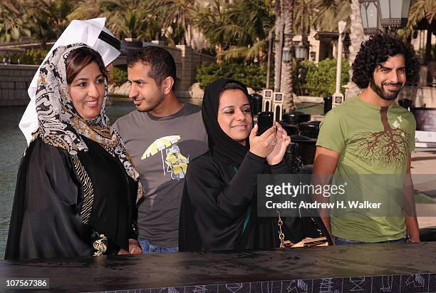 Directors Hujoom Al Ghanem, Moath Bin Hafez, Nayla Al Khaja and Khaled Al Mahmood attend the "Muhr Emirati" photocall during day three of the 7th...
